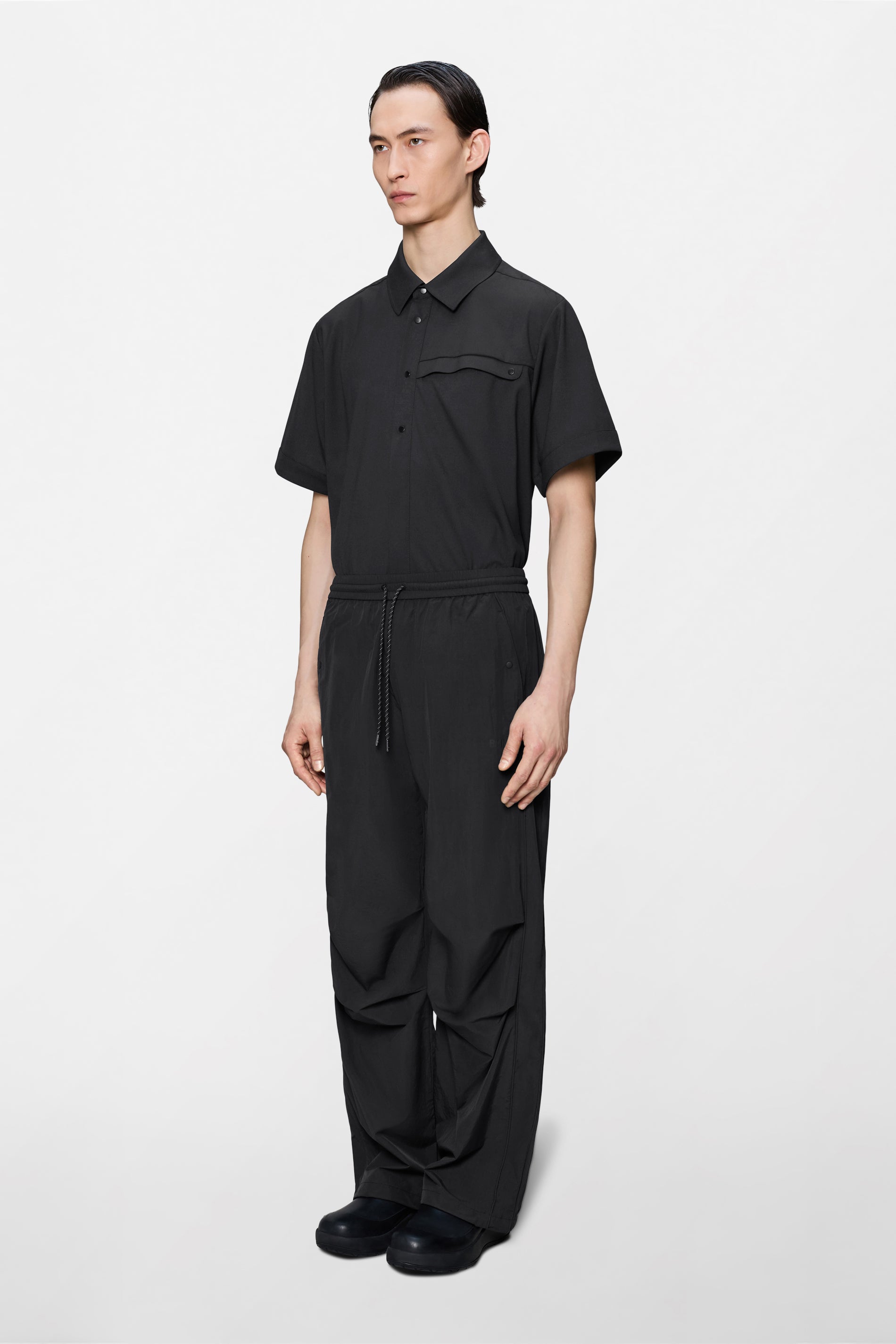RAINS Cooldown Track Pants Black Pants