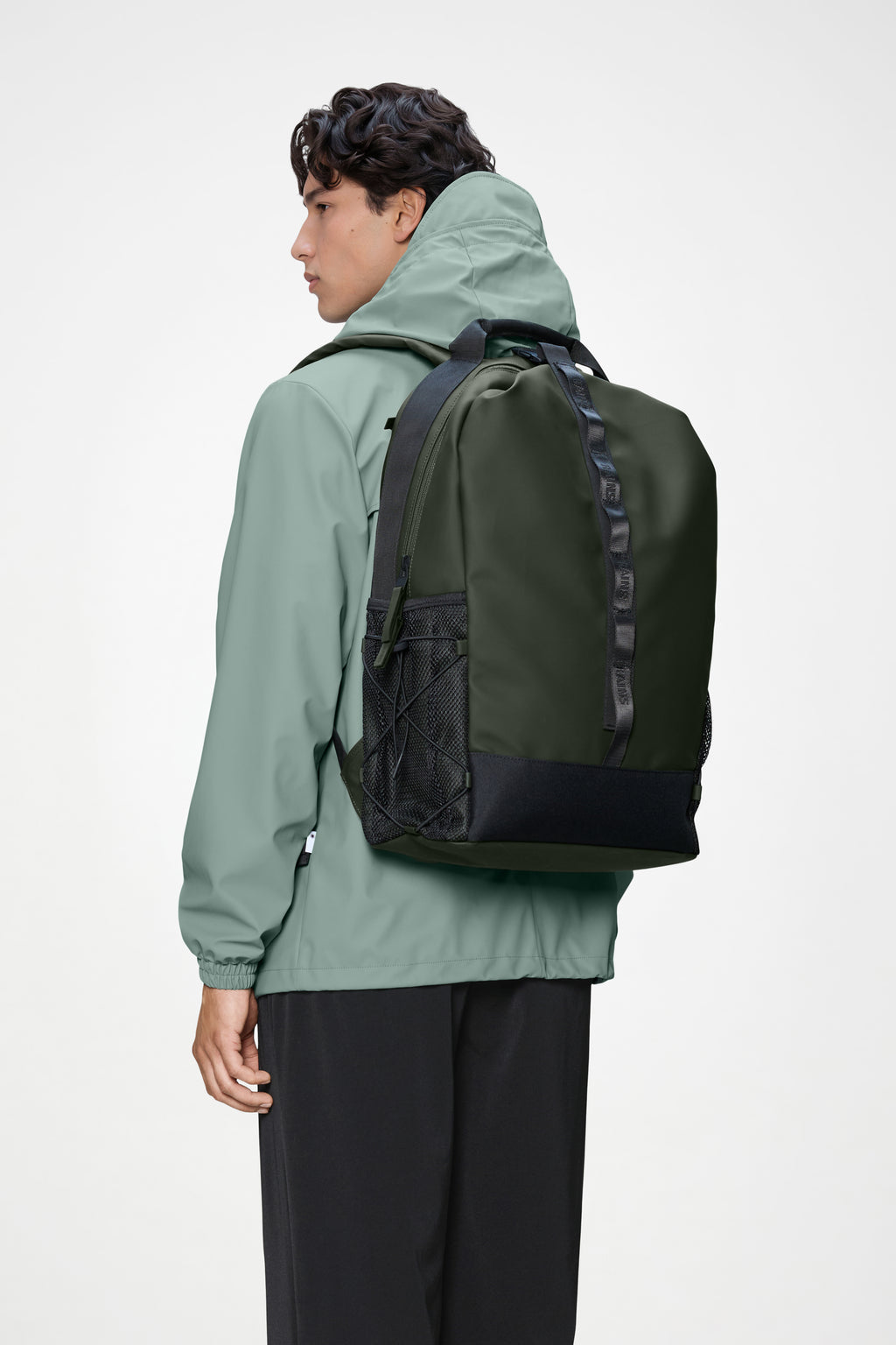 Rains® Trail Clip Front Backpack in Green for $195