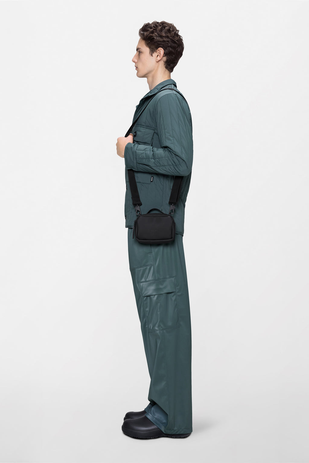 Rains® Box Bag Micro in Ember for $95