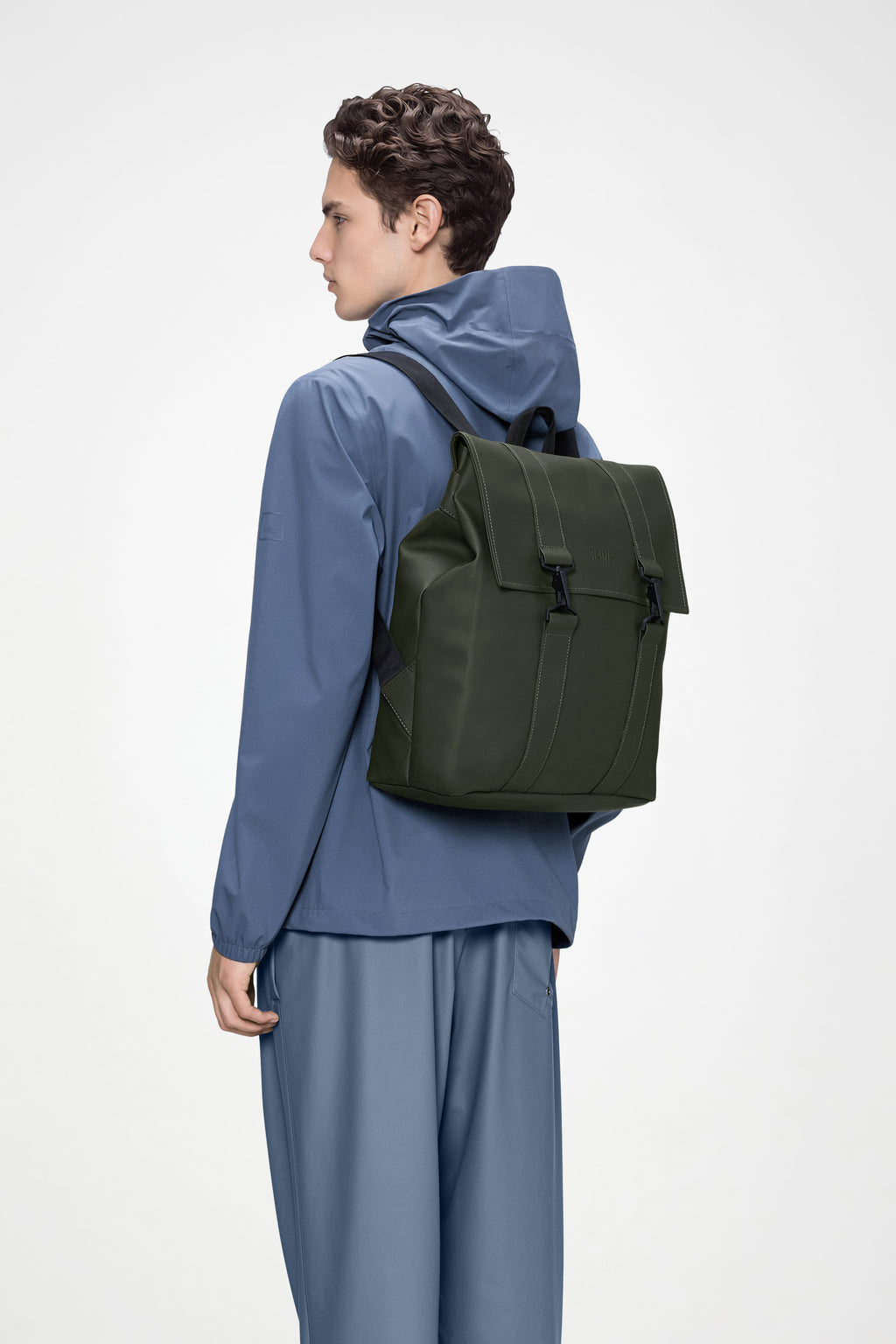 rains messenger backpack in dark teal Rains Bag Black for $135 The distinctive carabiner closure flap and compression opening add both practicality and style to this rucksack Rains MSN Bag in Black