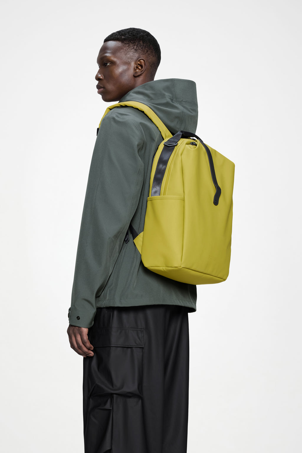 Rains® Clip Front Backpack in Glow for $160